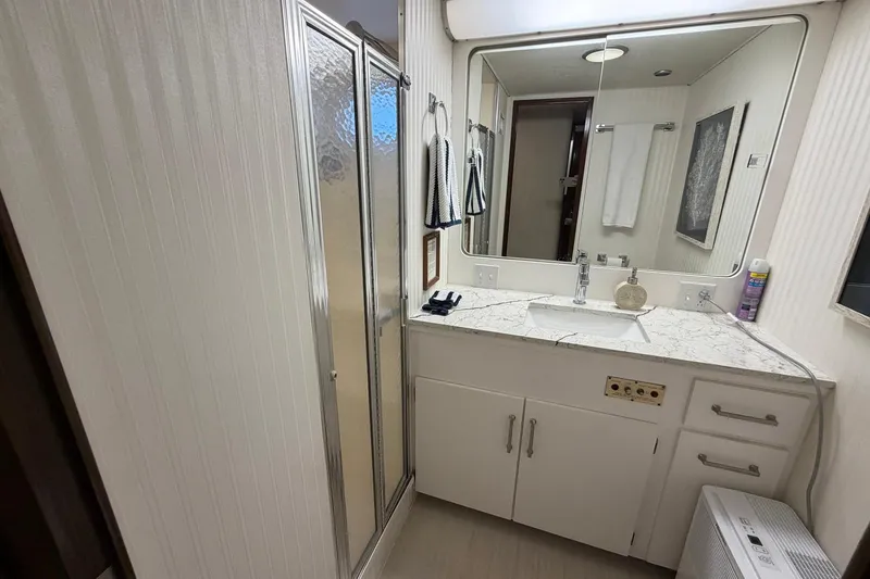Slide: The Image of Bathroom interior of 1987 Hatteras 58 Motor Yacht with marble countertop and shower. - 56