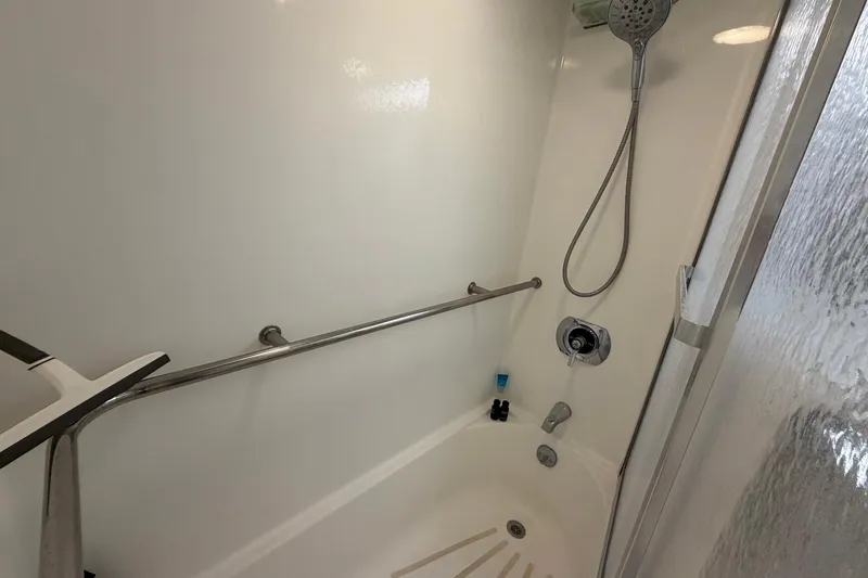 Slide: The Image of Shower area in 1987 Hatteras 58 Motor Yacht with handheld showerhead and grab bar. - 64
