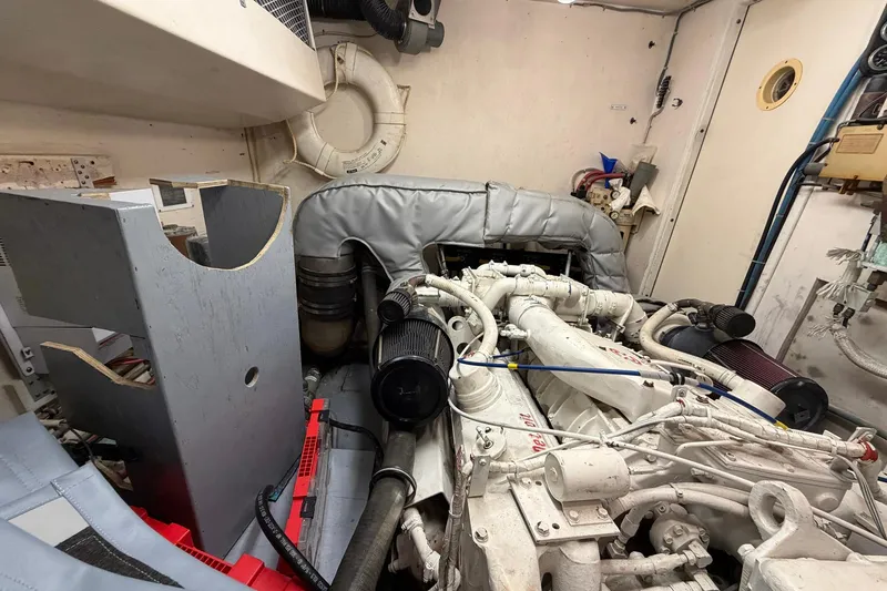 Slide: The Image of Engine room of 1987 Hatteras 58 Motor Yacht with visible machinery and equipment. - 71
