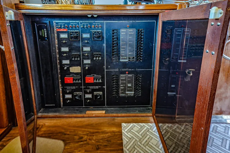 Slide: The Image of Electrical panel inside a 1987 Hatteras 58 Motor Yacht, featuring switches and controls. - 81