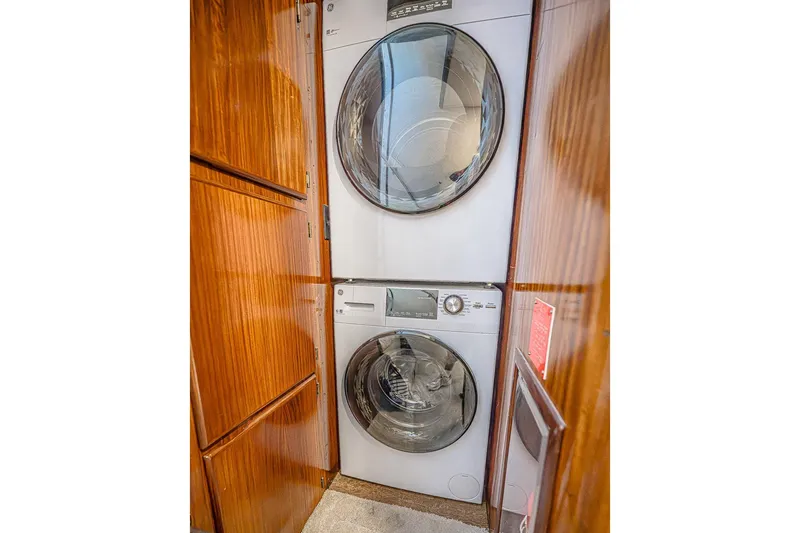 Slide: The Image of Stacked washer and dryer in 1987 Hatteras 58 Motor Yacht laundry area. - 86