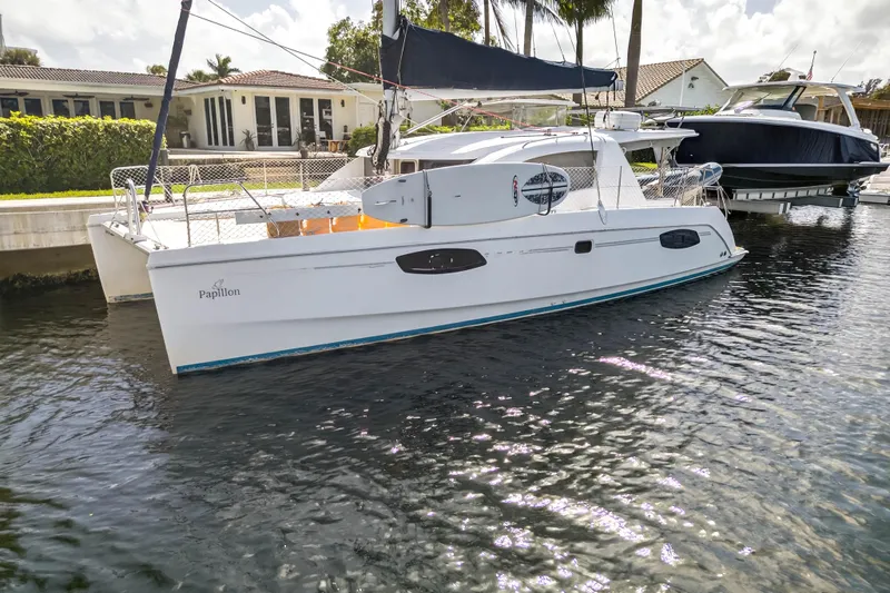 Slide: The Image of 2012 Leopard 39 catamaran docked in a sunny marina setting. - 15