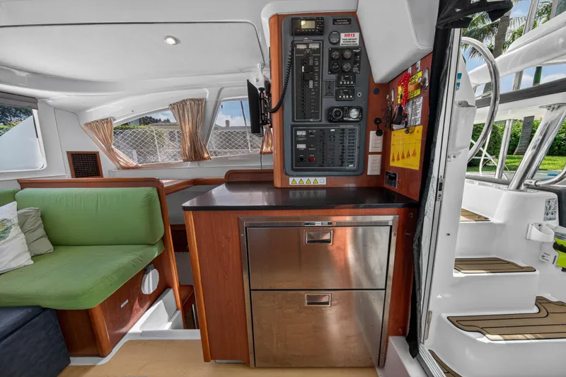 Slide: The Image of Interior of 2012 Leopard 39 yacht with control panel and green seating. - 22