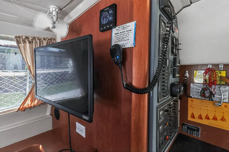 Slide: The Image of Interior of 2012 Leopard 39 yacht with control panel and mounted TV. - 23