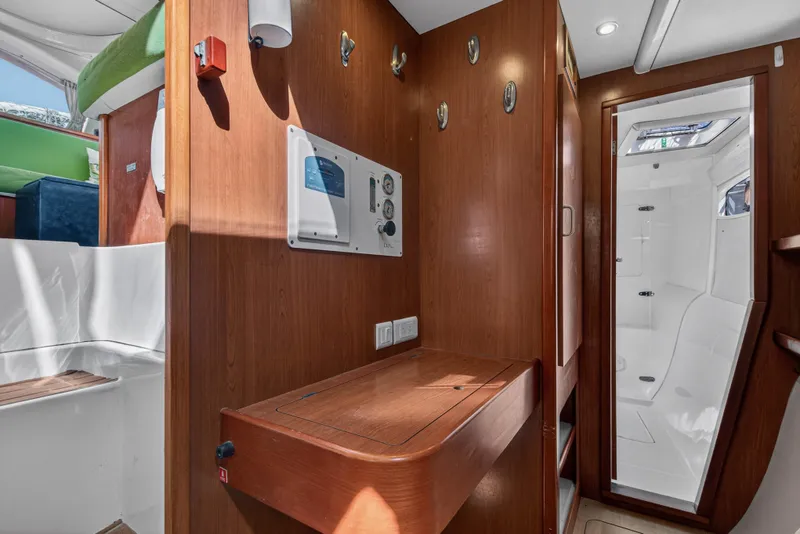 Slide: The Image of Interior of 2012 Leopard 39 yacht featuring wood paneling and modern amenities. - 31