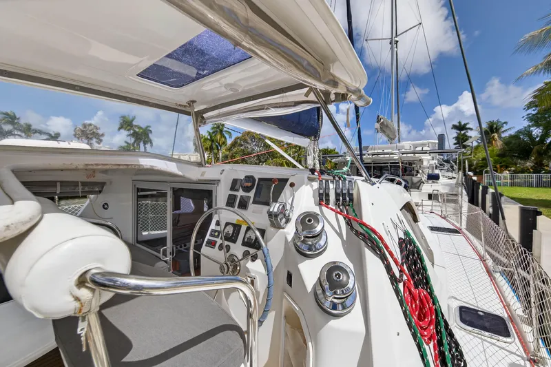 Slide: The Image of 2012 Leopard 39 yacht cockpit with steering wheel, control panel, and colorful ropes. - 37