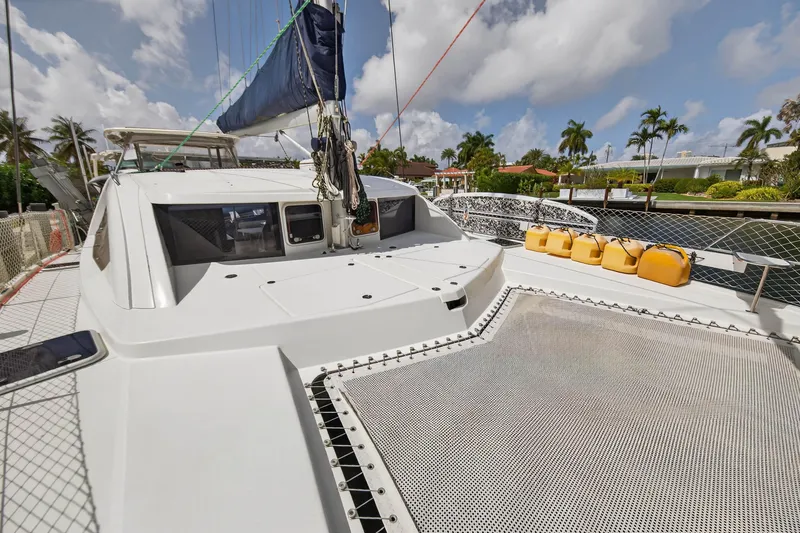 Slide: The Image of 2012 Leopard 39 catamaran deck with netting and yellow fuel containers. - 41