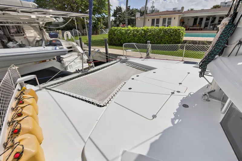 Slide: The Image of 2012 Leopard 39 catamaran deck with netting and docked view. - 43