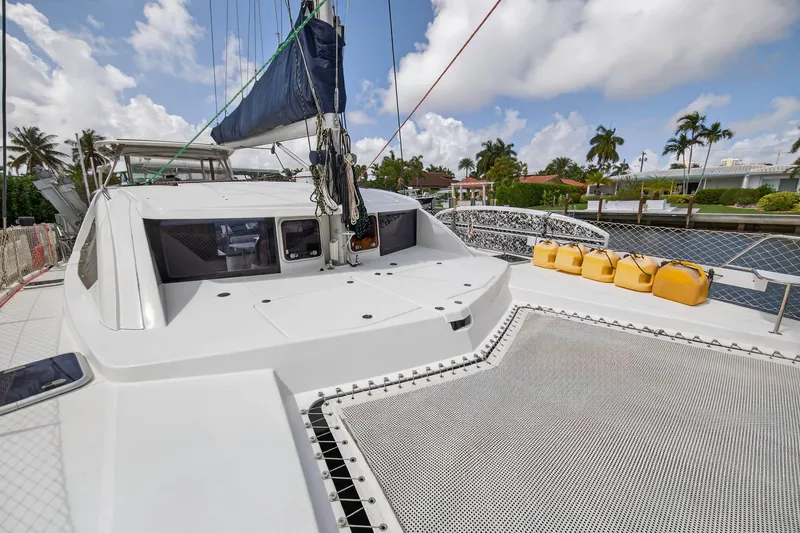Slide: The Image of Deck of 2012 Leopard 39 catamaran with teak flooring, docked at marina. - 49