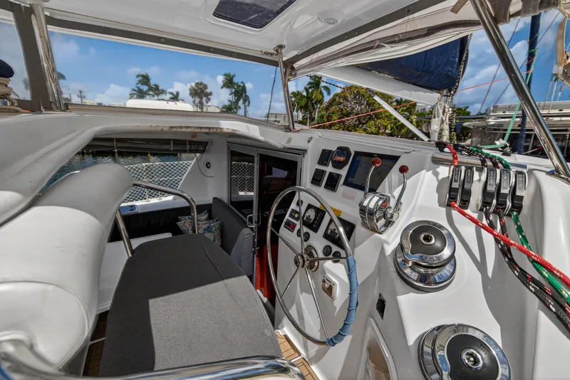 Slide: The Image of Cockpit of 2012 Leopard 39 yacht with steering wheel and control panel. - 6