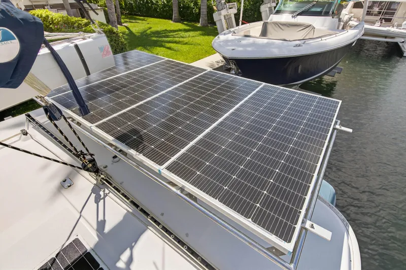Slide: The Image of Solar panels on a 2012 Leopard 39 yacht docked by the water. - 66