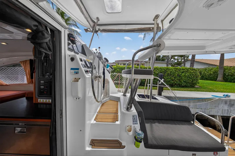 Slide: The Image of Interior view of 2012 Leopard 39 yacht, featuring helm station and seating area. - 67
