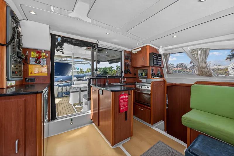 Slide: The Image of Interior of 2012 Leopard 39 yacht with modern kitchen and seating area. - 73