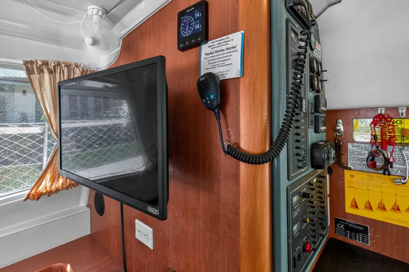 Slide: The Image of Interior of 2012 Leopard 39 yacht with control panel, monitor, and communication equipment. - 78
