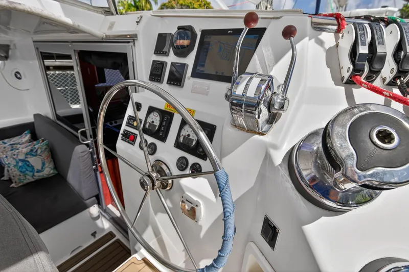 Slide: The Image of Steering wheel and controls of a 2012 Leopard 39 yacht cockpit. - 8