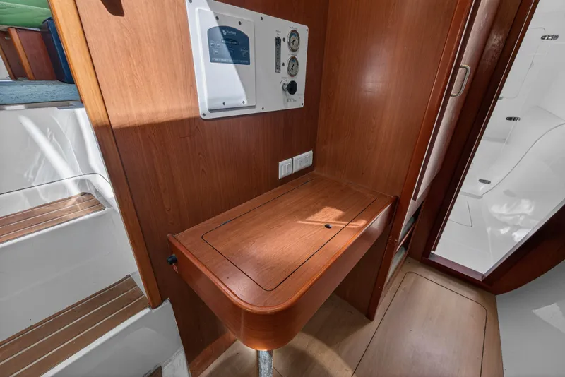 Slide: The Image of Interior of 2012 Leopard 39 yacht with wooden paneling and control panel. - 83