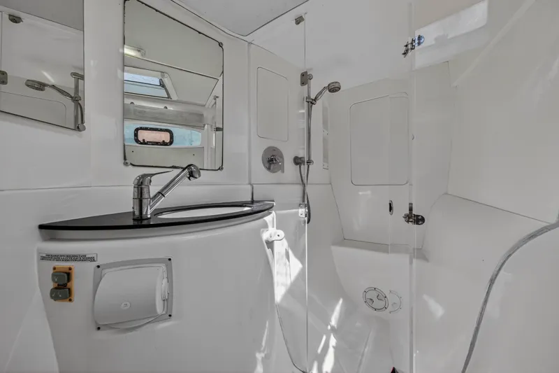 Slide: The Image of Modern bathroom in a 2012 Leopard 39 yacht, featuring sleek fixtures and ample lighting. - 85