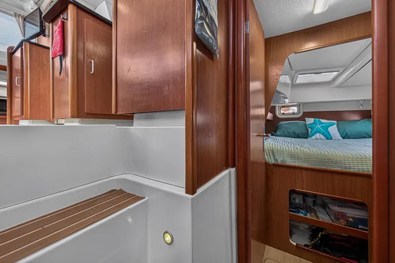 Slide: The Image of Interior of 2012 Leopard 39 yacht with cozy cabin and wooden cabinetry. - 93