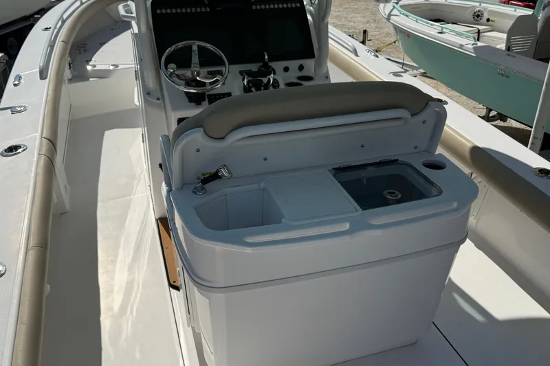 Slide: The Image of 2022 Everglades 273 Center Console boat interior with helm and seating area. - 16