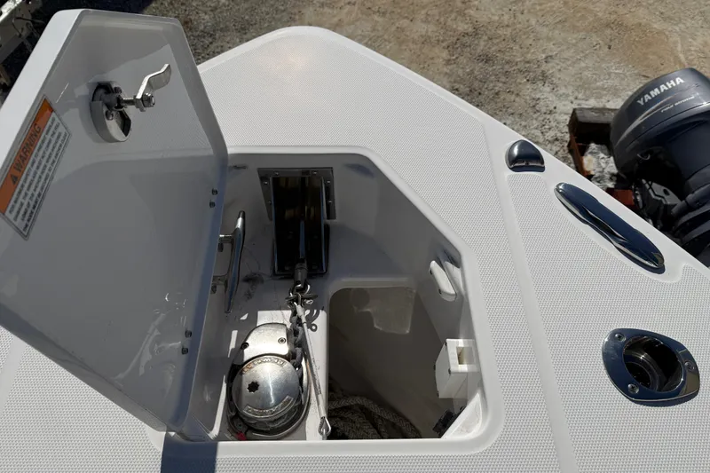 Slide: The Image of Open anchor locker on 2022 Everglades 273 Center Console boat, showing anchor and chain. - 5