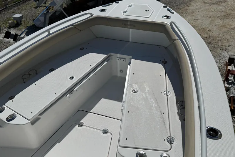Slide: The Image of 2022 Everglades 273 Center Console boat interior with seating and storage compartments. - 6