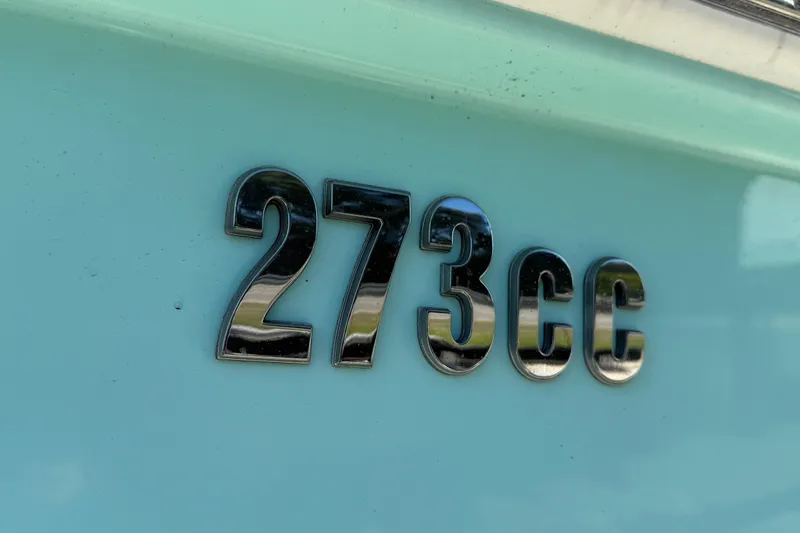 Slide: The Image of Close-up of 2022 Everglades 273 Center Console boat emblem on light blue surface. - 8