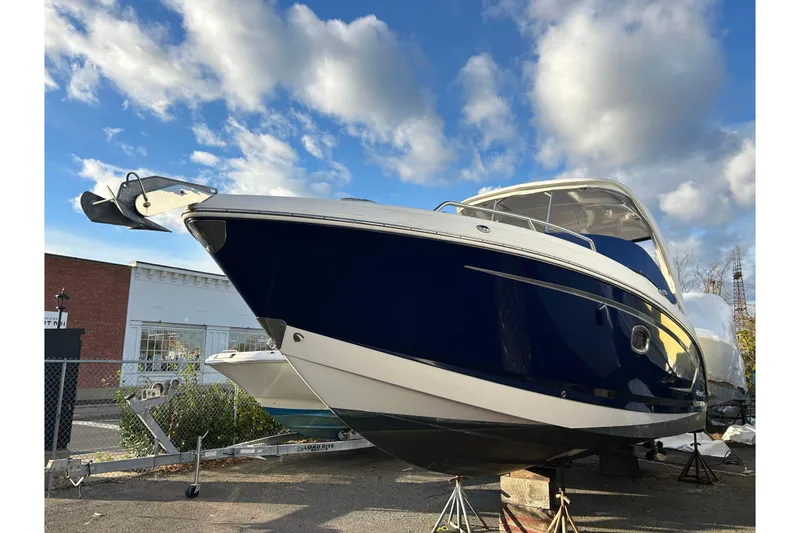 Slide: The Image of 2017 Chaparral 307 SSX boat on display under a blue sky. - 1