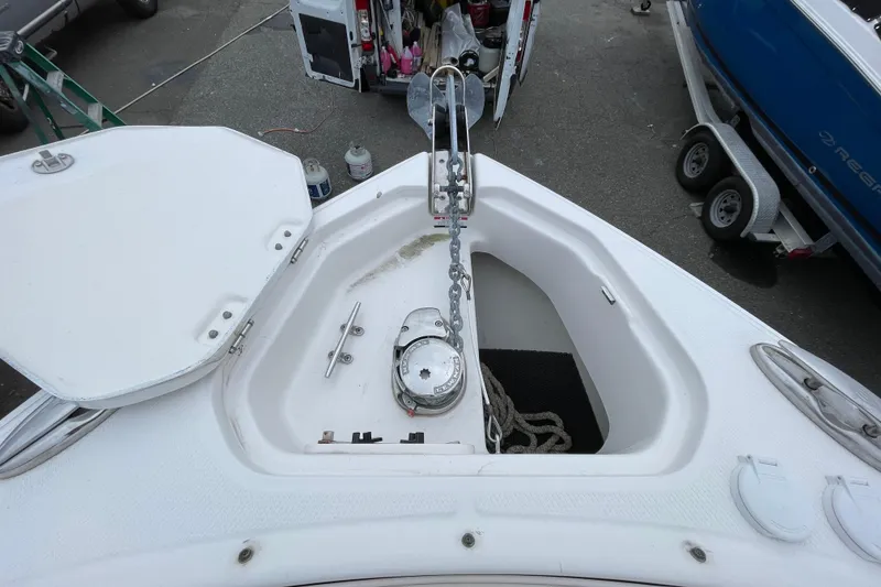 Slide: The Image of 2017 Chaparral 307 SSX boat anchor compartment with chain and rope. - 11