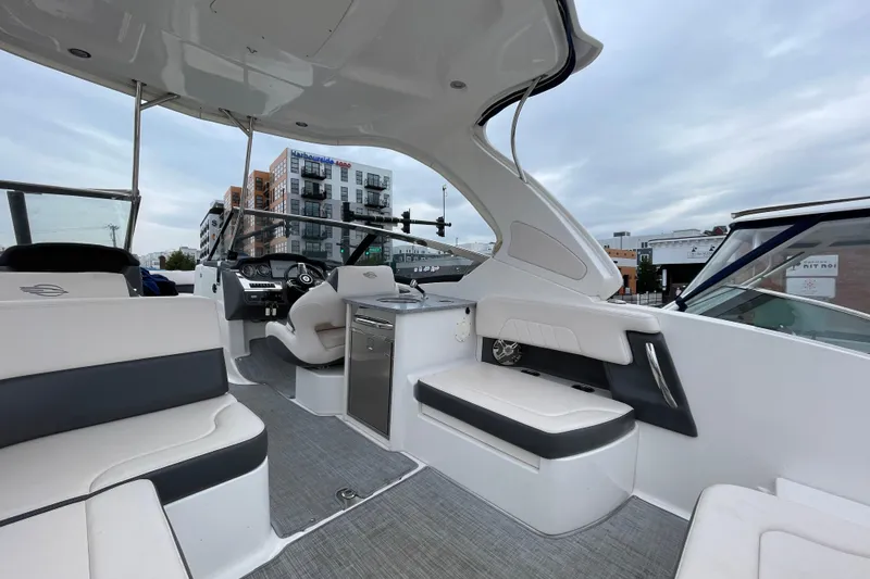 Slide: The Image of 2017 Chaparral 307 SSX boat interior with modern seating and dashboard. - 3