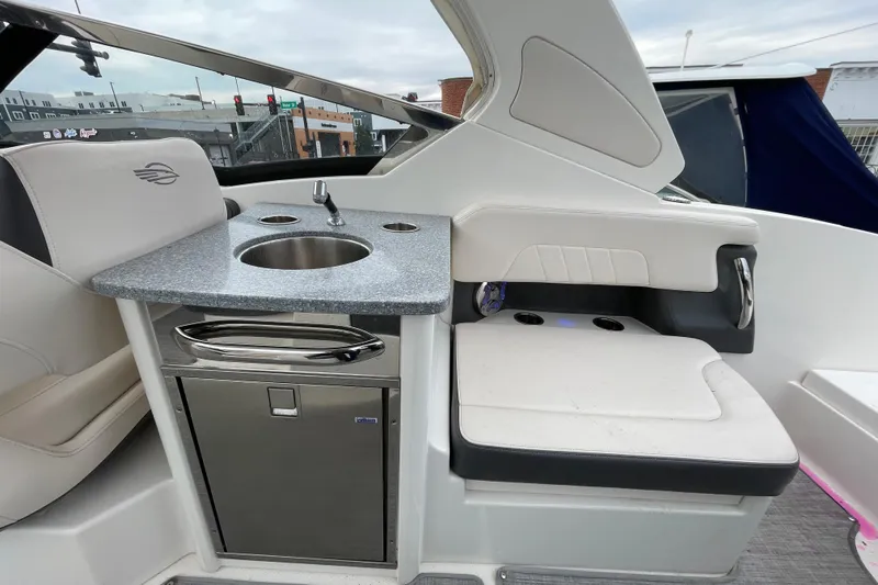 Slide: The Image of 2017 Chaparral 307 SSX boat interior with sink and seating area. - 4