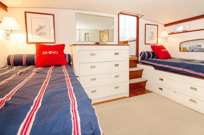 Slide: The Image of 1958 Rybovich 54 Yachtfish cabin with twin beds, nautical decor, and elegant wood accents. - 15