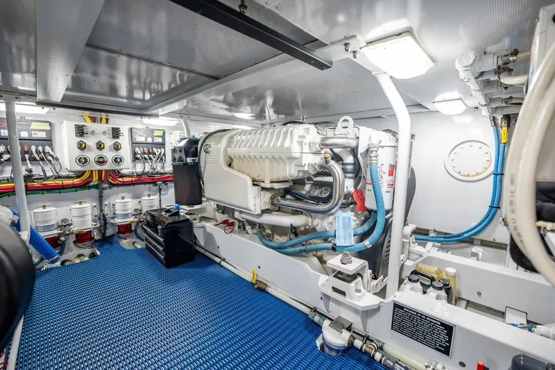 Slide: The Image of Engine room of a 1958 Rybovich 54 Yachtfish, showcasing detailed mechanical components. - 13