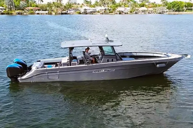 The Image of 2016 Hydra-Sports 4200 Siesta boat on calm water, featuring sleek design and powerful engines. - 1