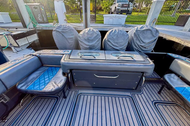 Slide: The Image of 2016 Hydra-Sports 4200 Siesta boat interior with covered seats and storage compartments. - 10