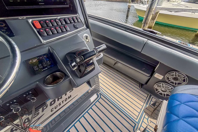 Slide: The Image of 2016 Hydra-Sports 4200 Siesta boat cockpit with control panel and seating. - 19