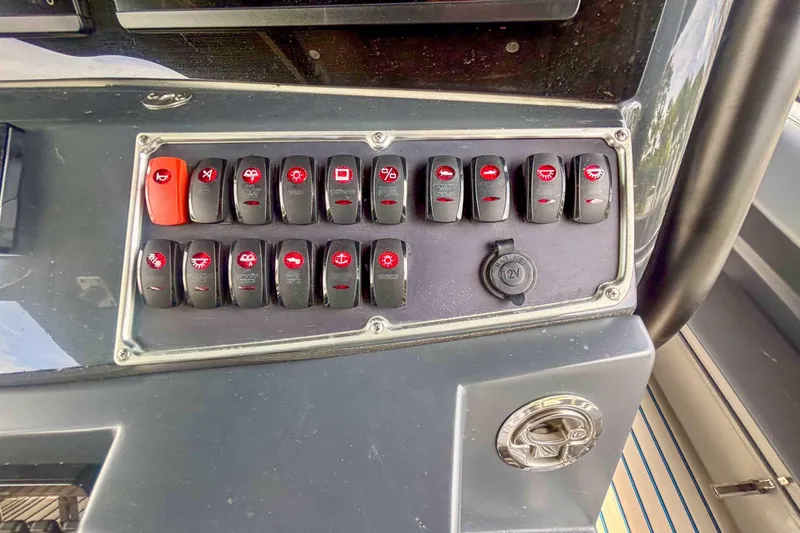 Slide: The Image of Control panel of a 2016 Hydra-Sports 4200 Siesta boat with labeled switches. - 20