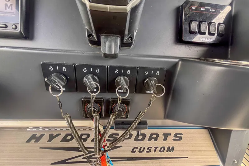 Slide: The Image of Control panel of a 2016 Hydra-Sports 4200 Siesta boat with Yamaha ignition switches. - 21