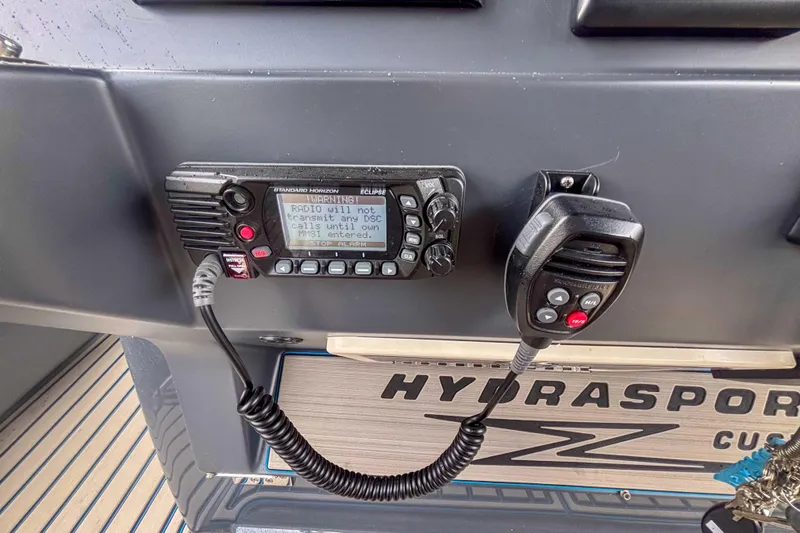 Slide: The Image of 2016 Hydra-Sports 4200 Siesta dashboard with Standard Horizon radio and microphone. - 22