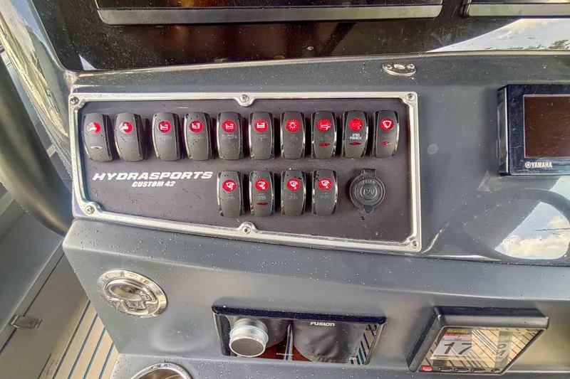 Slide: The Image of Control panel of 2016 Hydra-Sports 4200 Siesta boat with switches and displays. - 24