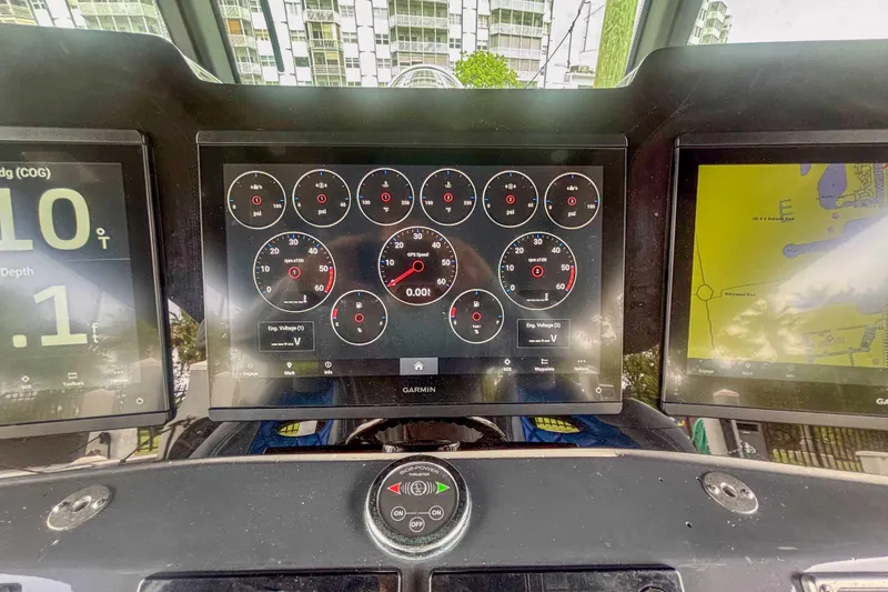 Slide: The Image of Dashboard of a 2016 Hydra-Sports 4200 Siesta with Garmin displays and gauges. - 26
