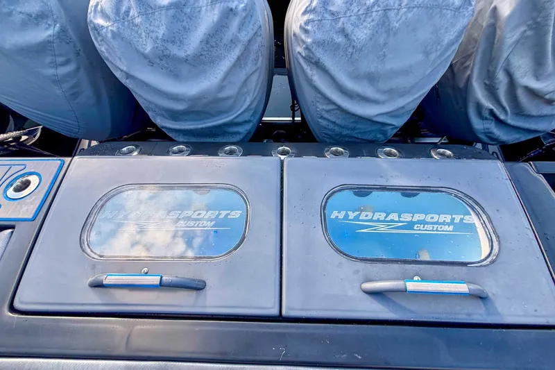 Slide: The Image of 2016 Hydra-Sports 4200 Siesta boat with custom storage compartments and covered seats. - 3