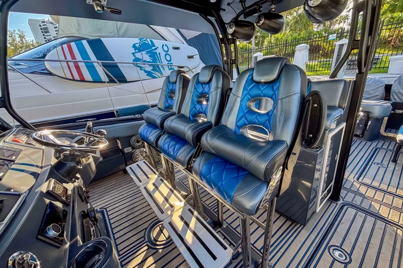 Slide: The Image of Interior of 2016 Hydra-Sports 4200 Siesta boat with blue leather seating and modern controls. - 30
