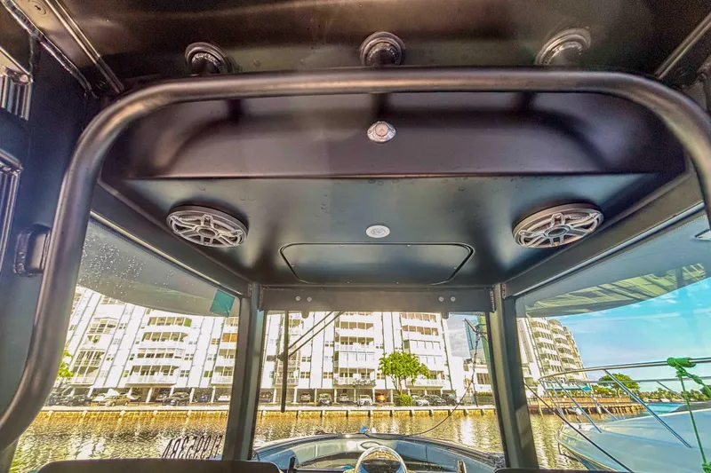 Slide: The Image of Interior view of 2016 Hydra-Sports 4200 Siesta boat with cityscape background. - 33