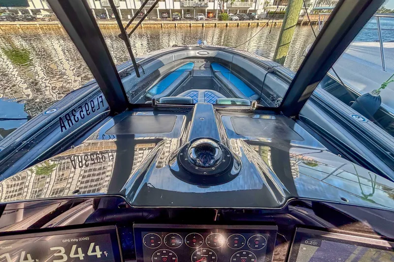 Slide: The Image of 2016 Hydra-Sports 4200 Siesta boat cockpit with navigation instruments and waterfront view. - 34