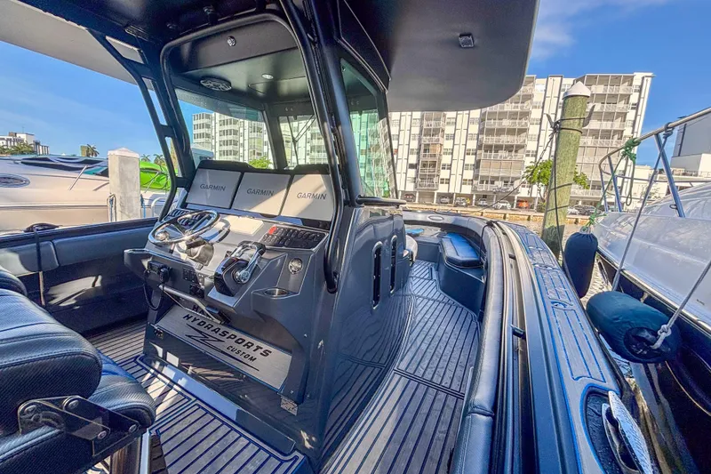 Slide: The Image of 2016 Hydra-Sports 4200 Siesta boat interior with Garmin navigation displays. - 37