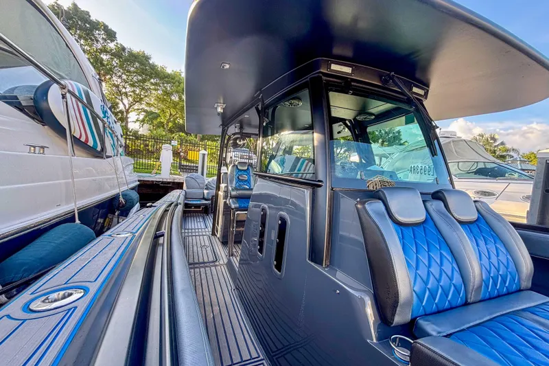 Slide: The Image of 2016 Hydra-Sports 4200 Siesta boat with blue seating and sleek design at a marina. - 42