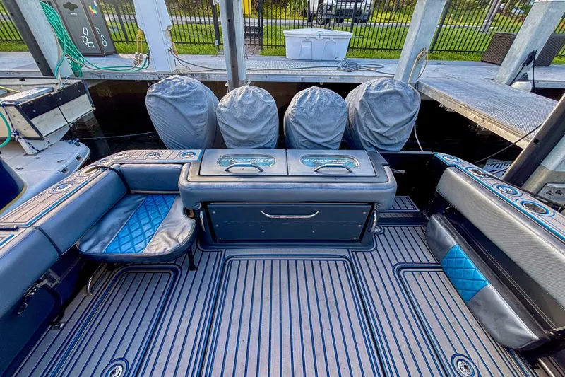 Slide: The Image of 2016 Hydra-Sports 4200 Siesta boat interior with seating and covered engines. - 9