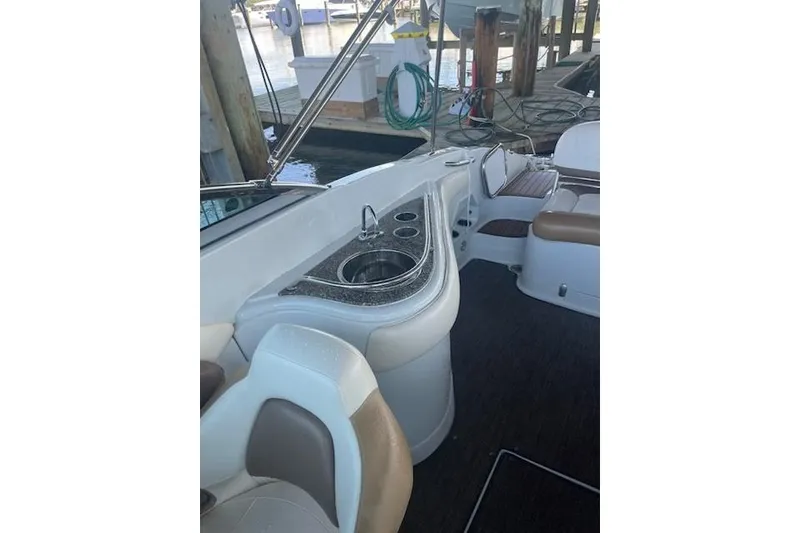 Slide: The Image of 2015 Crownline Eclipse E6 boat interior with sink and seating area. - 5