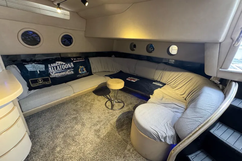 Slide: The Image of Luxurious 1996 Sea Ray 500 Sedan Bridge interior with cozy seating and nautical decor. - 16