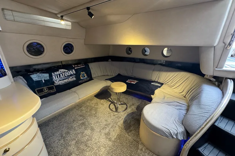 Slide: The Image of Luxurious interior of a 1996 Sea Ray 500 Sedan Bridge with cozy seating and nautical decor. - 17